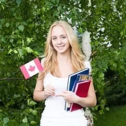 Portrait of a blond girl with Canadian f